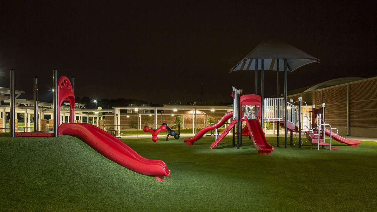 Nighttime artificial turf playground by Southwest Greens of Fresno